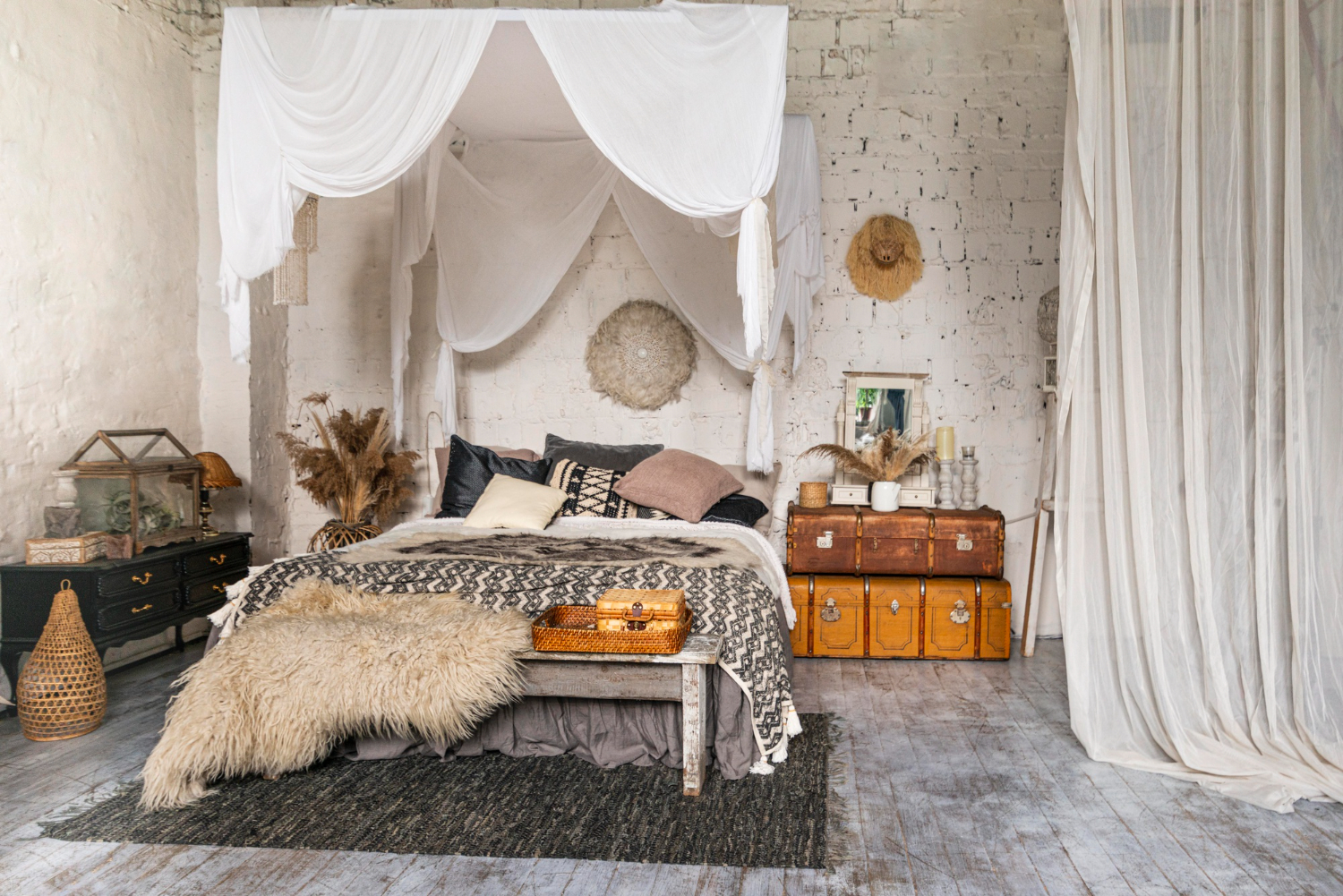 A stylish bedroom showcasing a canopy bed and a plush rug, creating a warm and inviting atmosphere